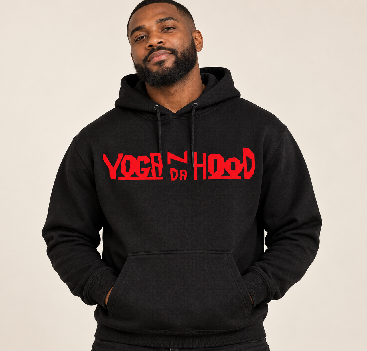 Male model wearing a black Yoga N Da Hood hoodie with a red logo