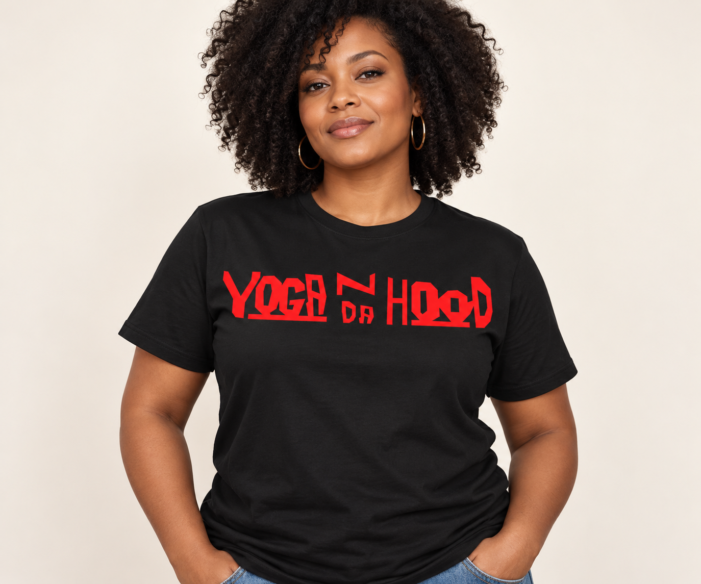 Black Yoga N Da Hood T-shirt with a red logo, modeled against a warm neutral background
